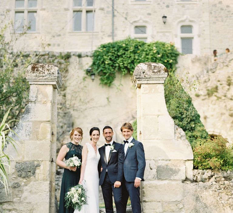 Wedding Party | Bride in Pronovias Gown | Bridesmaid in Forest Green Dress | Groom in Black Tie | Fairytale Castle Wedding at Chateau de Lisse in France | Lilli Kad Photography