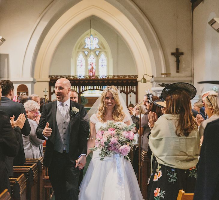 Bride & Groom Married walking up the Altar