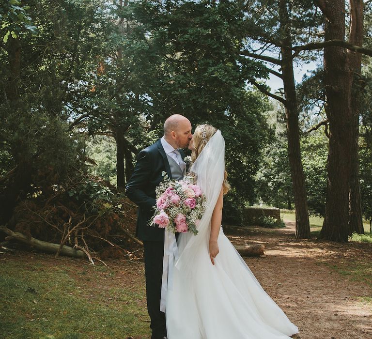 Bride in Suzanne Neville Dress & Groom in Traditional Tales