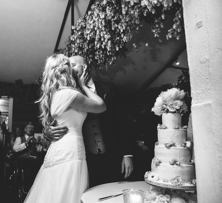 Bride & Groom Cutting The Cake