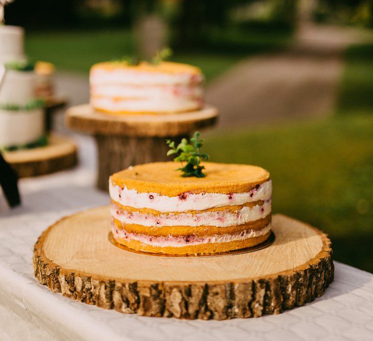 Rustic Cake Table With Wooden Log Slices