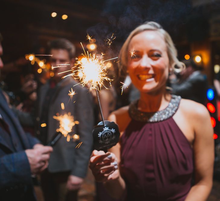 Bridesmaid in Burgundy Warehouse Dress with Sparkler