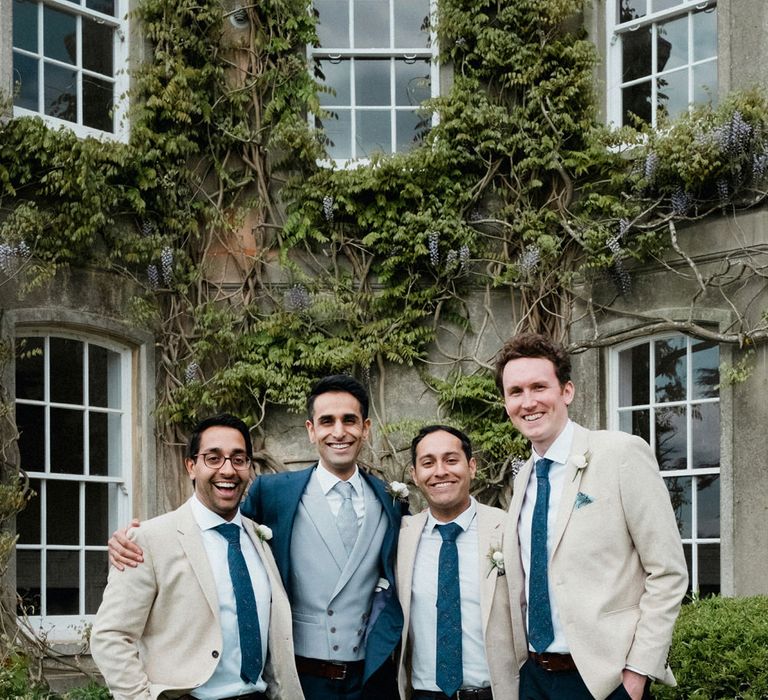 Groom in Navy Suit Supply | Groomsmen in Beige Reiss Jacket | English & Asian Wedding at Northbrook Park | Claudia Rose Carter