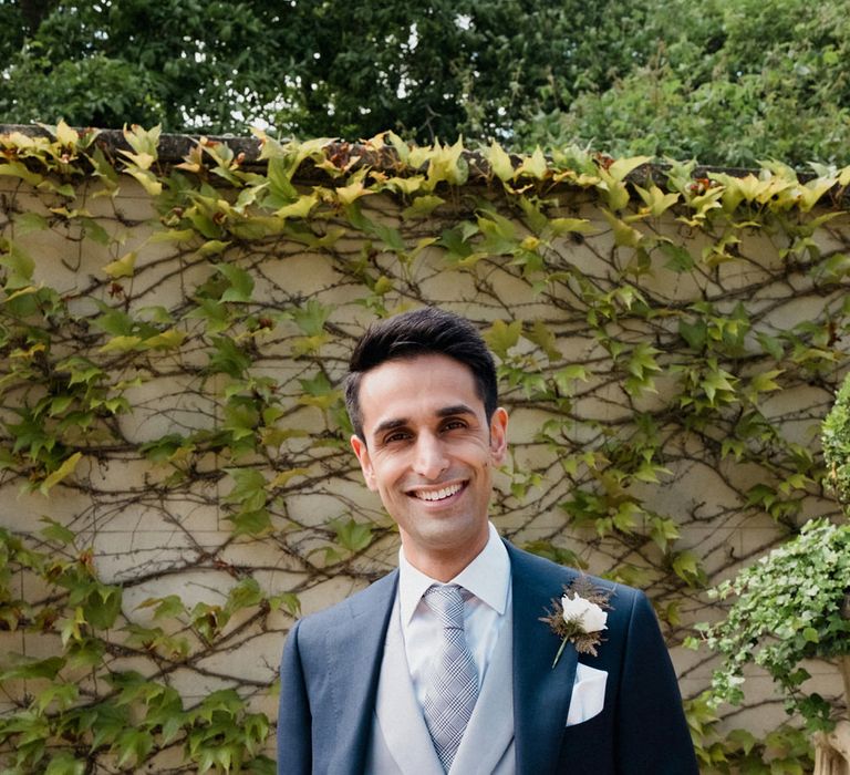 Groom in Suit Supply | English & Asian Wedding at Northbrook Park | Claudia Rose Carter