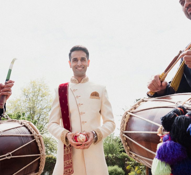 Groom in Traditional Indian Dress | English & Asian Wedding at Northbrook Park | Claudia Rose Carter