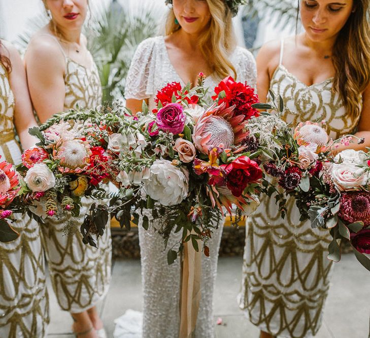 Bridesmaids in Virgos lounge Gowns & Giant Red & White Bouquets