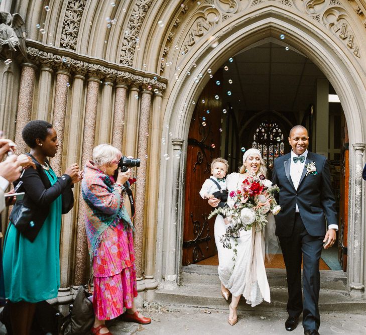 Bride in Eliza Jane Howell Clarissa Wedding Dress & Juliet Cap Veil & Groom in Tuxedo Church Exit