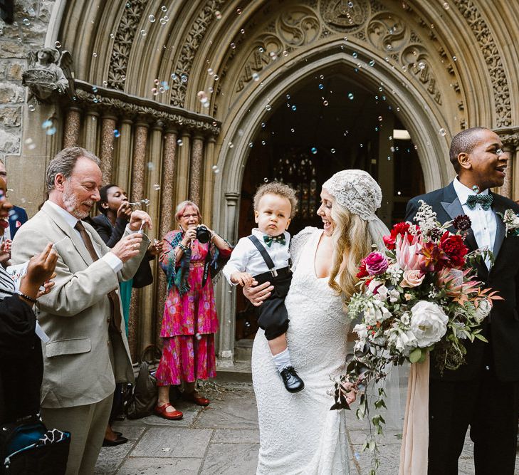 Bride in Eliza Jane Howell Clarissa Wedding Dress & Juliet Cap Veil & Groom in Tuxedo Church Exit