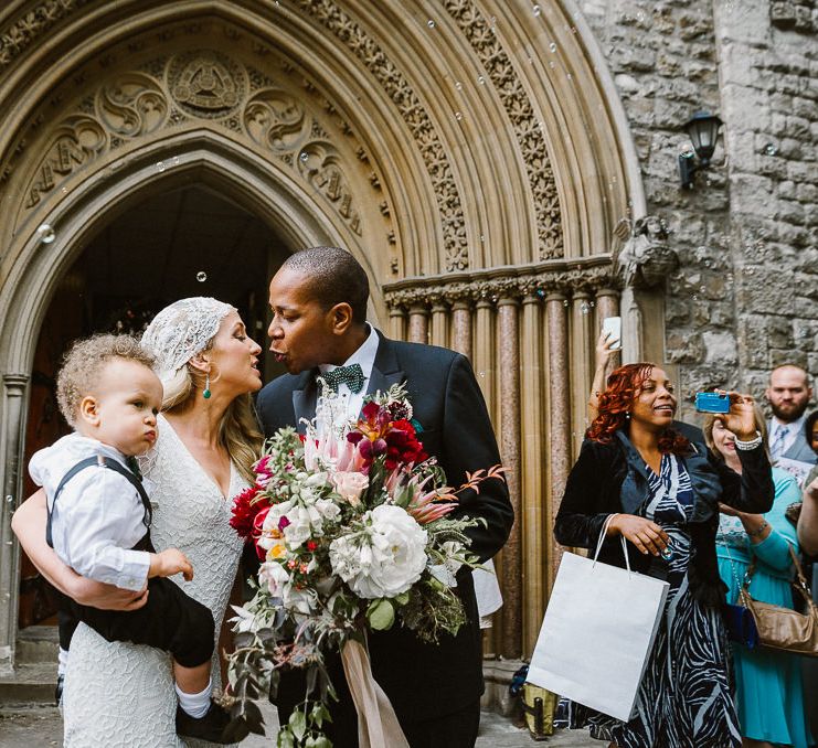 Bride in Eliza Jane Howell Clarissa Wedding Dress & Juliet Cap Veil & Groom in Tuxedo Church Exit