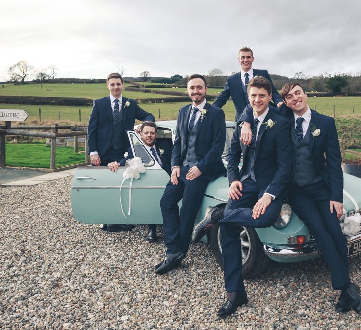 Groomsmen In Navy Suits With Waistcoats