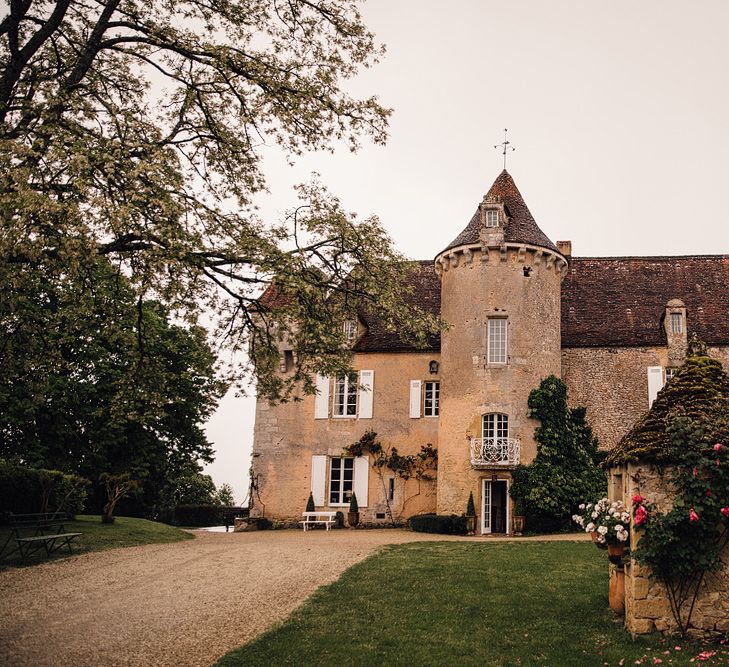 Elegant Pronovias Bride For A Destination Wedding At Chateau de Cazenac With Rustic Rose Floral Arrangements And Images From Samuel Docker