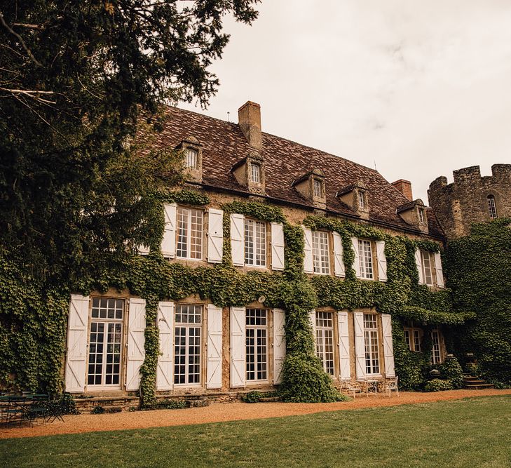 Elegant Pronovias Bride For A Destination Wedding At Chateau de Cazenac With Rustic Rose Floral Arrangements And Images From Samuel Docker