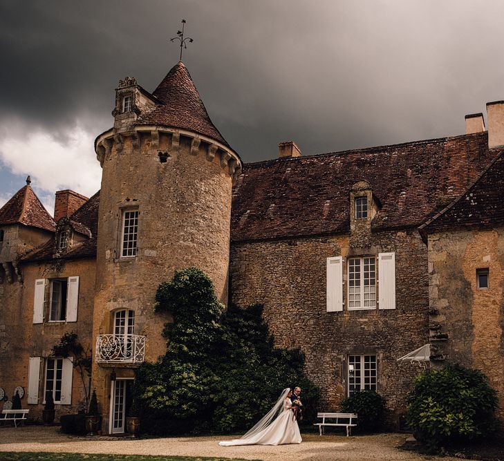 Elegant Pronovias Bride For A Destination Wedding At Chateau de Cazenac With Rustic Rose Floral Arrangements And Images From Samuel Docker