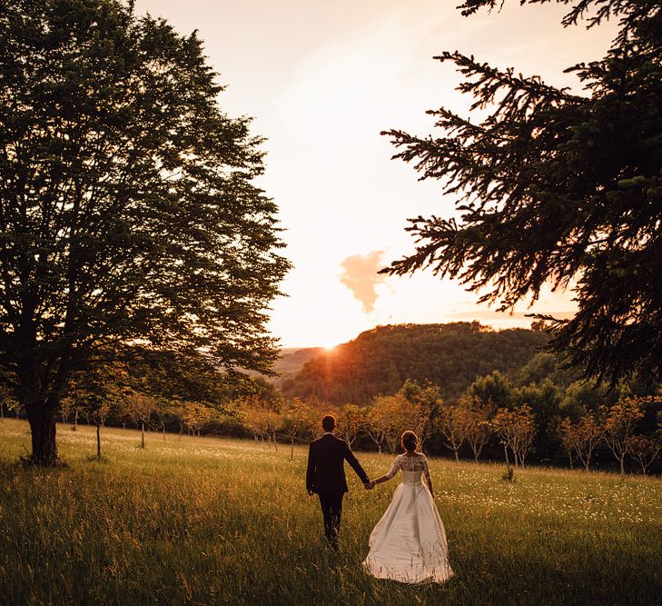 Elegant Pronovias Bride For A Destination Wedding At Chateau de Cazenac With Rustic Rose Floral Arrangements And Images From Samuel Docker