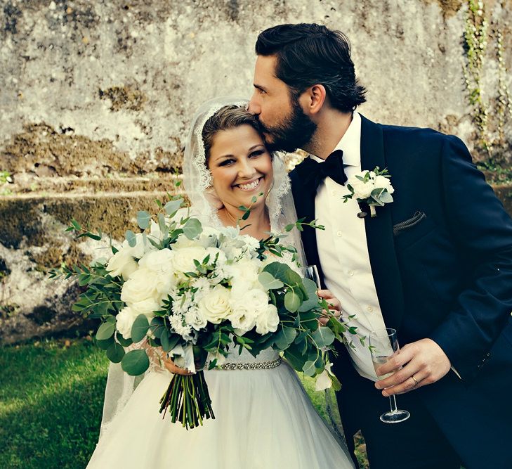 Bride in Bespoke Lyn Ashworth by Sarah Barrett Wedding Dress & Groom in Charles Tyrwhitt Black Tie Suit