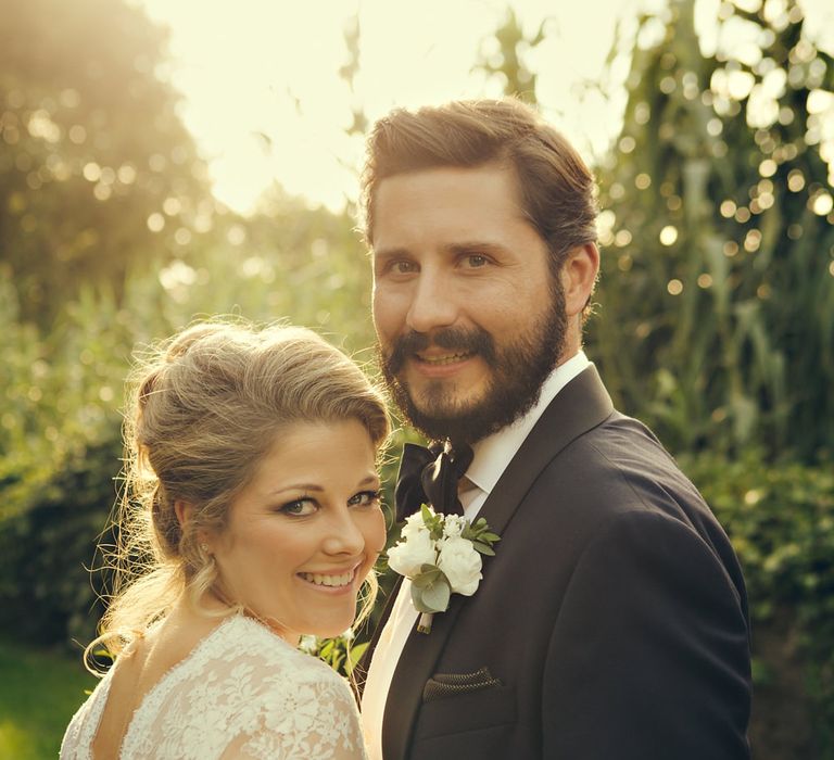 Bride in Bespoke Lyn Ashworth by Sarah Barrett Wedding Dress & Groom in Charles Tyrwhitt Black Tie Suit