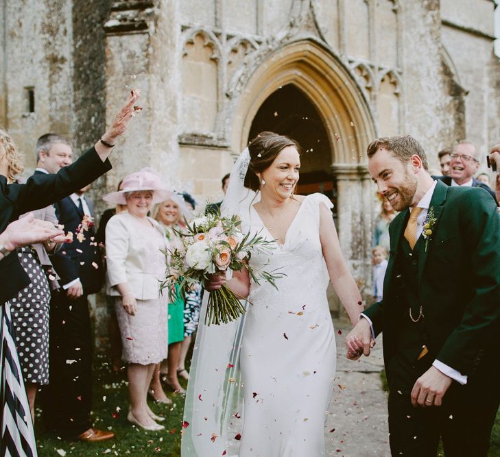 Confetti Moment | Bride in Rose & Delilah Gown | Groom in Donegal Green Wool Three Piece Suit from Beggars Run | David Jenkins Photography | Confetti & Silk Films