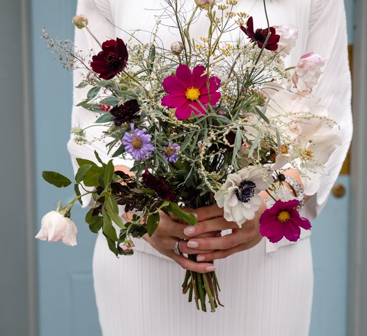 Wild Flower Bouquet | Bride in Pleats Please Issey Miyak Dress | Chic London Wedding at St Bartholomew the Great Church & St John Bar & Restaurant | Helen Abraham Photography