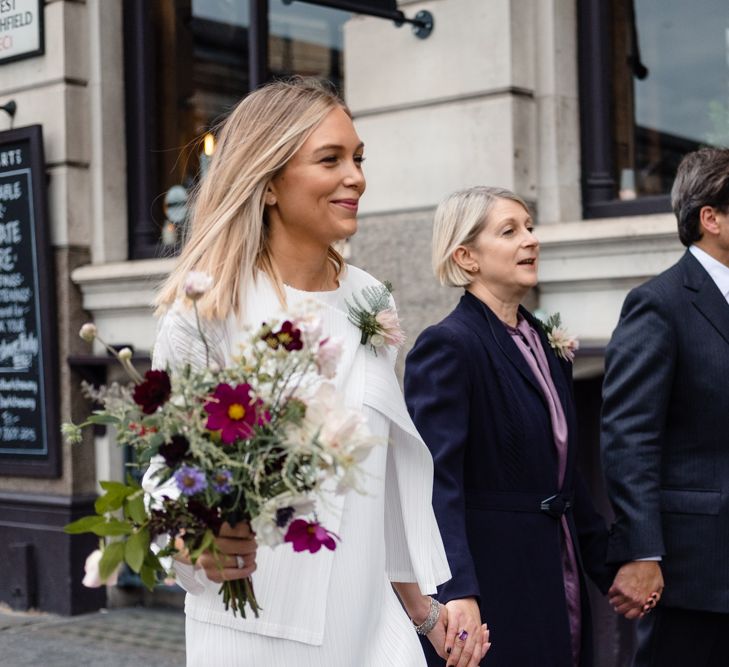 Pleats Please Issey Miyak Dress | Chic London Wedding at St Bartholomew the Great Church & St John Bar & Restaurant | Helen Abraham Photography