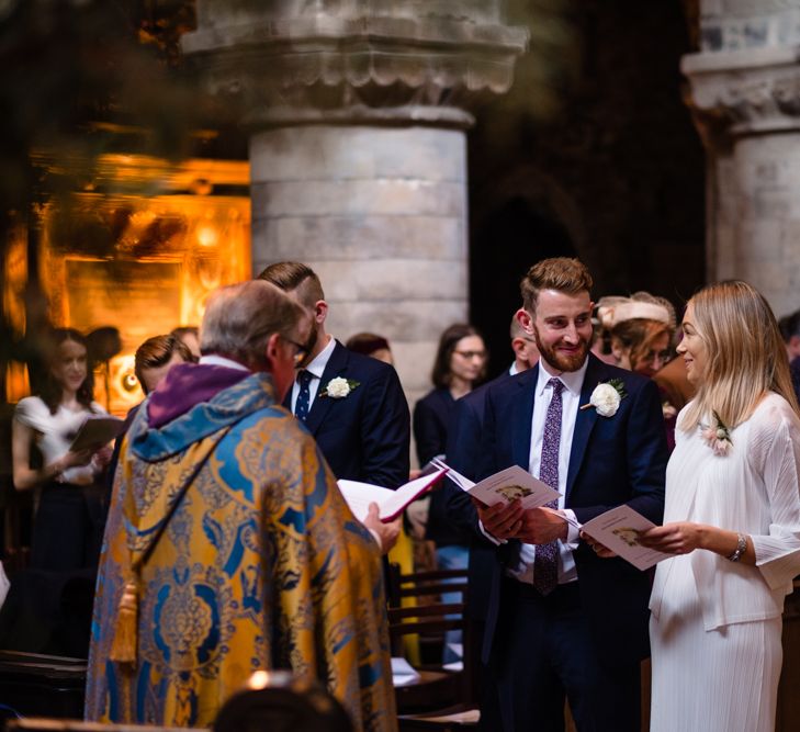 Wedding Ceremony | Bride in Pleats Please Issey Miyak Dress | Groom in Beggars Run Suit | Chic London Wedding at St Bartholomew the Great Church & St John Bar & Restaurant | Helen Abraham Photography