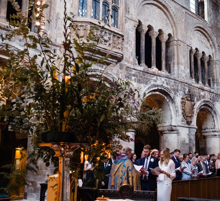 Wedding Ceremony | Bride in Pleats Please Issey Miyak Dress | Groom in Beggars Run Suit | Chic London Wedding at St Bartholomew the Great Church & St John Bar & Restaurant | Helen Abraham Photography