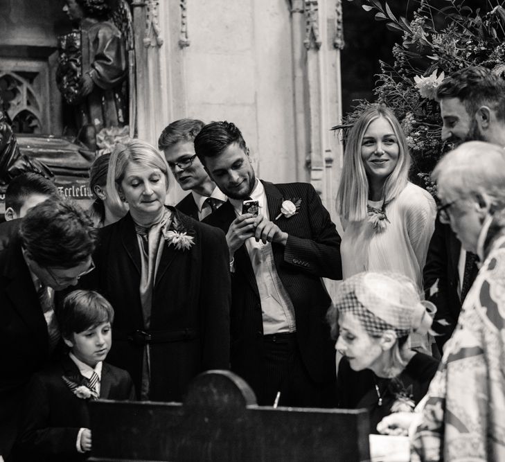 Wedding Ceremony | Bride in Pleats Please Issey Miyak Dress | Groom in Beggars Run Suit | Chic London Wedding at St Bartholomew the Great Church & St John Bar & Restaurant | Helen Abraham Photography