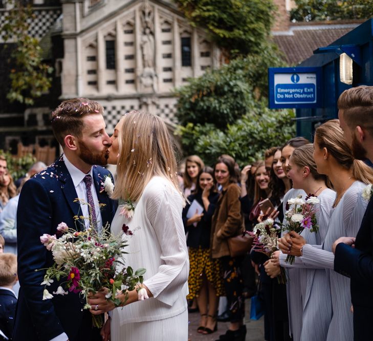 Confetti Exit | Bride in Pleats Please Issey Miyak Dress | Groom in Beggars Run Suit | Chic London Wedding at St Bartholomew the Great Church & St John Bar & Restaurant | Helen Abraham Photography