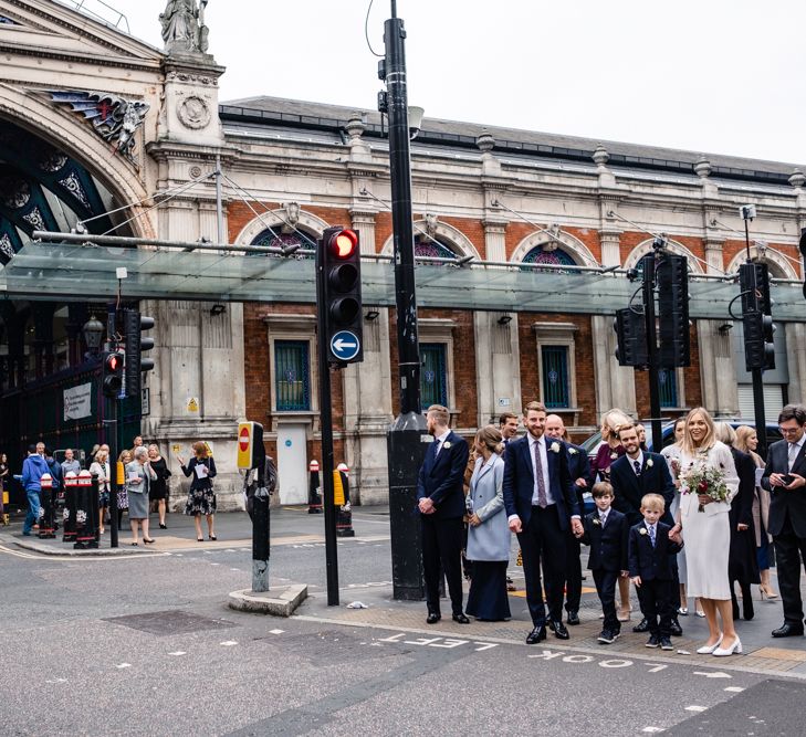 Bride in Pleats Please Issey Miyak Dress | Groom in Beggars Run Suit | Chic London Wedding at St Bartholomew the Great Church & St John Bar & Restaurant | Helen Abraham Photography