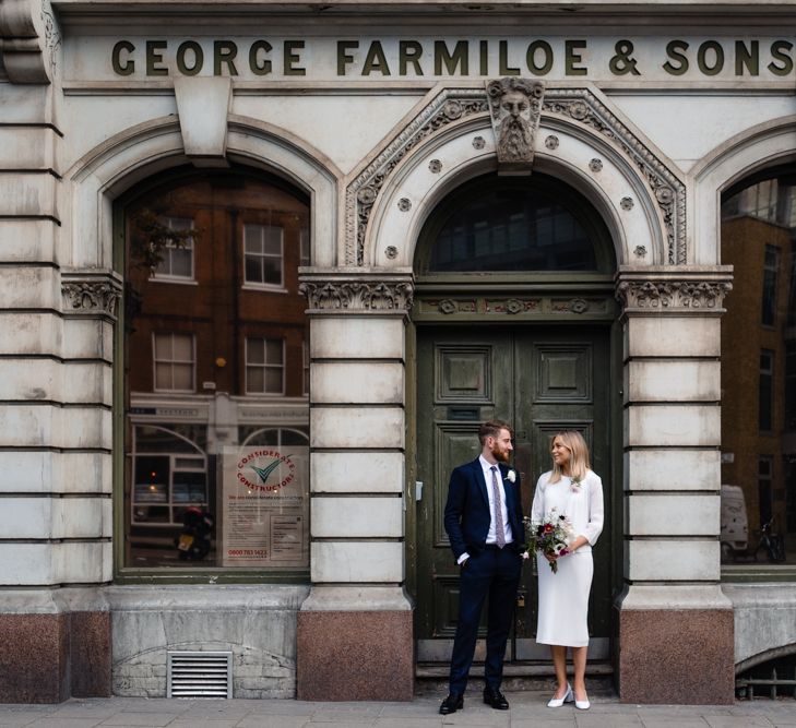 Bride in Pleats Please Issey Miyak Dress | Groom in Beggars Run Suit | Chic London Wedding at St Bartholomew the Great Church & St John Bar & Restaurant | Helen Abraham Photography