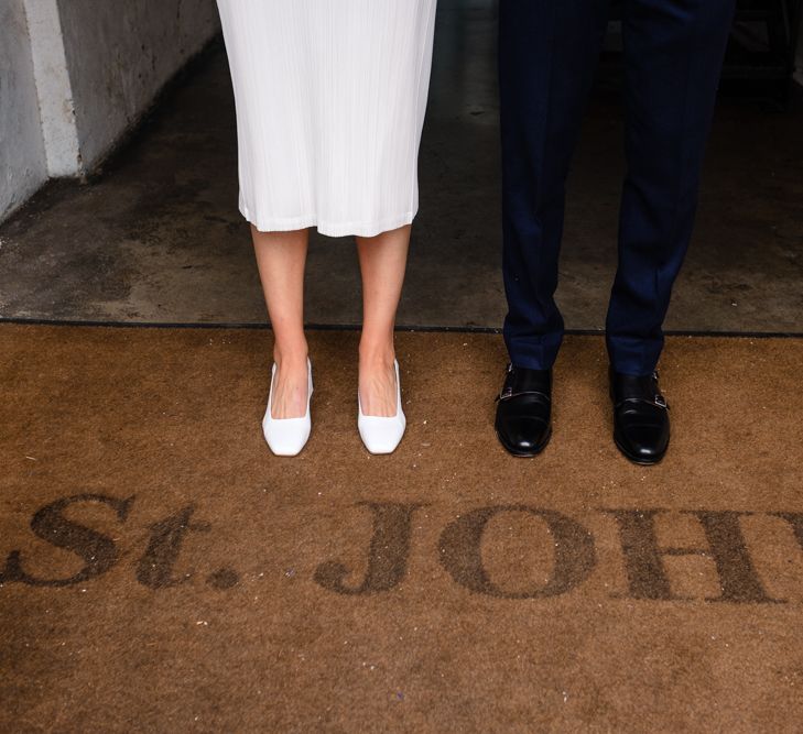 Bride in Pleats Please Issey Miyak Dress | Groom in Beggars Run Suit | Chic London Wedding at St Bartholomew the Great Church & St John Bar & Restaurant | Helen Abraham Photography