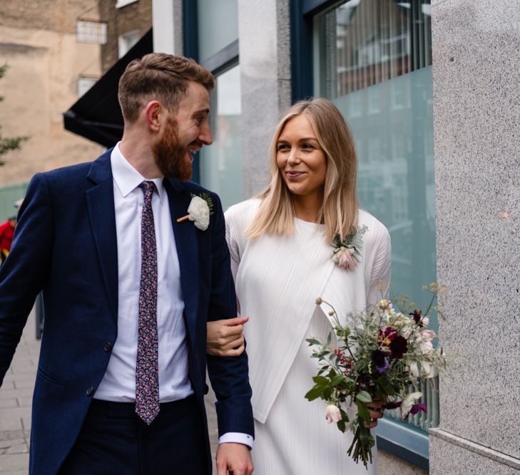 Bride in Pleats Please Issey Miyak Dress | Groom in Beggars Run Suit | Chic London Wedding at St Bartholomew the Great Church & St John Bar & Restaurant | Helen Abraham Photography