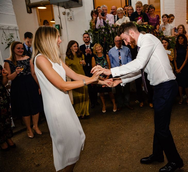 First Dance | Bride in Pleats Please Issey Miyak Dress | Groom in Beggars Run Suit | Chic London Wedding at St Bartholomew the Great Church & St John Bar & Restaurant | Helen Abraham Photography