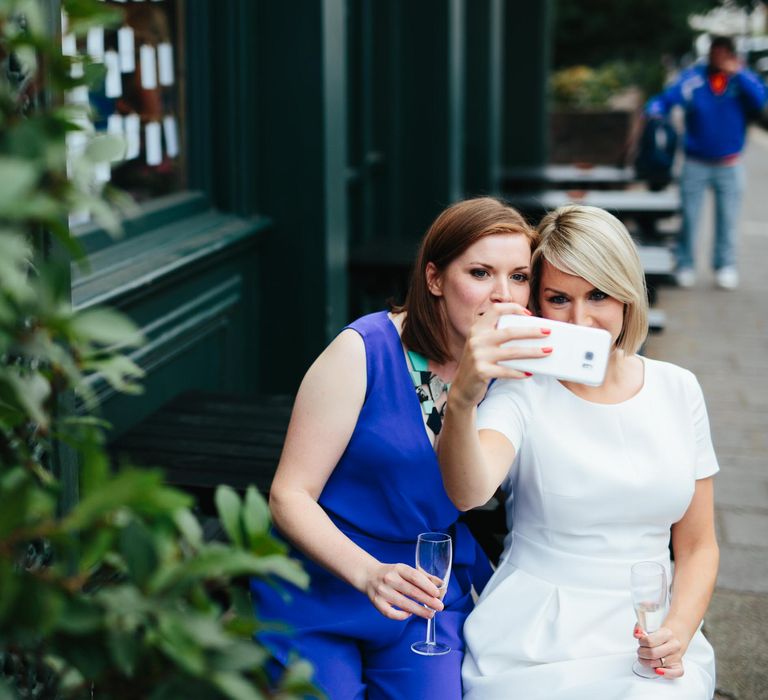 Two Brides in White Hugo Boss Dress & Cobalt Blue Diane Von Furstenberg Jumpsuit