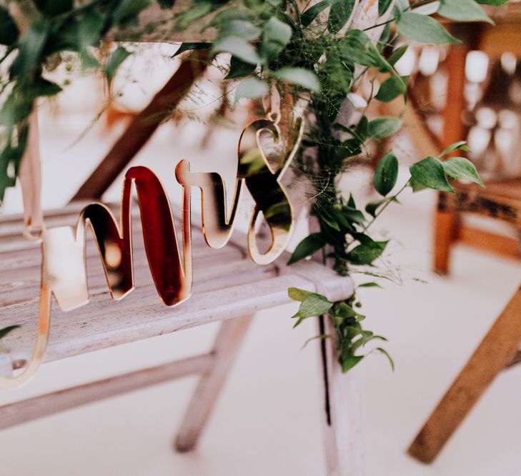 Copper Mrs Chair Back Decor | Stylish Woodland Wedding in Cheshire | Clara Cooper Photography | Story Board Weddings Films