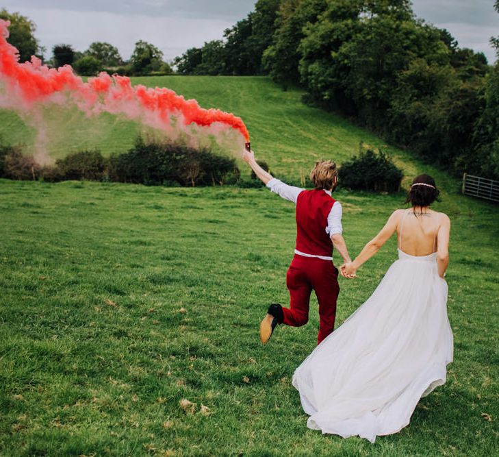 Smoke Bomb | Bride in Bo & Luca Bridal Gown | Groom in Bespoke Burgundy Suit | Stylish Woodland Wedding in Cheshire | Clara Cooper Photography | Story Board Weddings Films