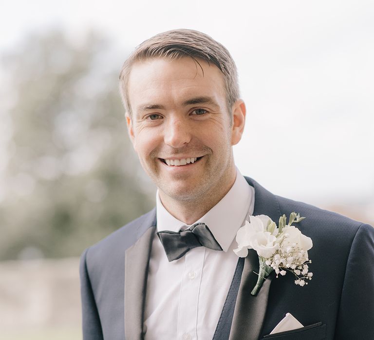 Groom in Three Piece Navy Tuxedo Suit | Elegant Black Tie Wedding with White Flowers at The Cleveland Tontine, North Yorkshire | Georgina Harrison Photography