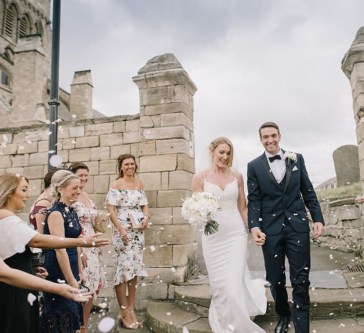 Confetti Exit | Bride in Enzoani Juri Bridal Gown | Groom in Black Tie | Elegant Black Tie Wedding with White Flowers at The Cleveland Tontine, North Yorkshire | Georgina Harrison Photography