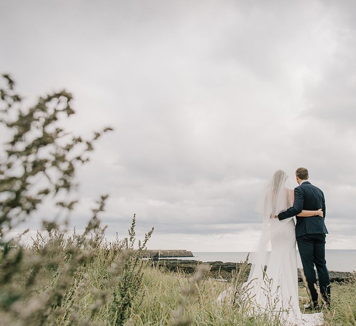 Bride in Enzoani Juri Bridal Gown | Groom in Black Tie | Elegant Black Tie Wedding with White Flowers at The Cleveland Tontine, North Yorkshire | Georgina Harrison Photography