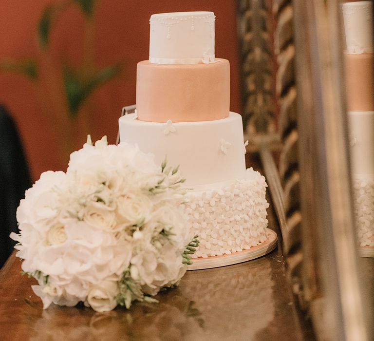 White Iced Wedding Cake with Copper Layer | Elegant Black Tie Wedding with White Flowers at The Cleveland Tontine, North Yorkshire | Georgina Harrison Photography