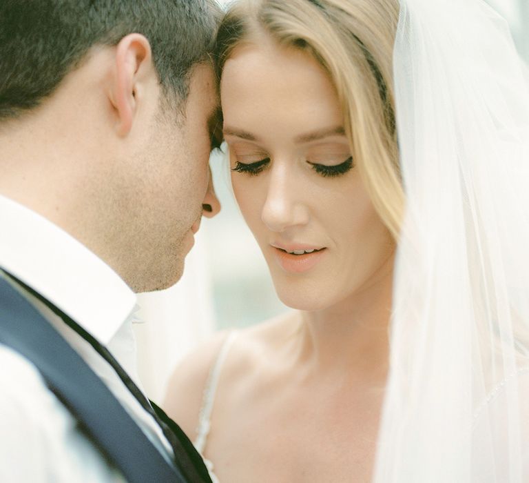 Bride in Enzoani Juri Bridal Gown | Groom in Black Tie | Elegant Black Tie Wedding with White Flowers at The Cleveland Tontine, North Yorkshire | Georgina Harrison Photography