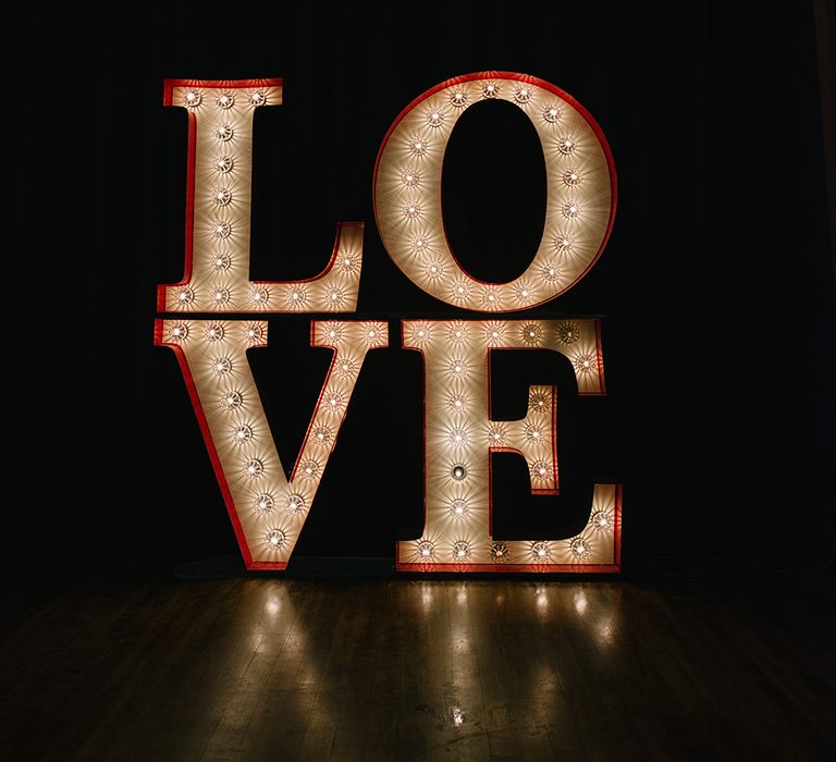 Giant Love Light Wedding Sign | Elegant Black Tie Wedding with White Flowers at The Cleveland Tontine, North Yorkshire | Georgina Harrison Photography