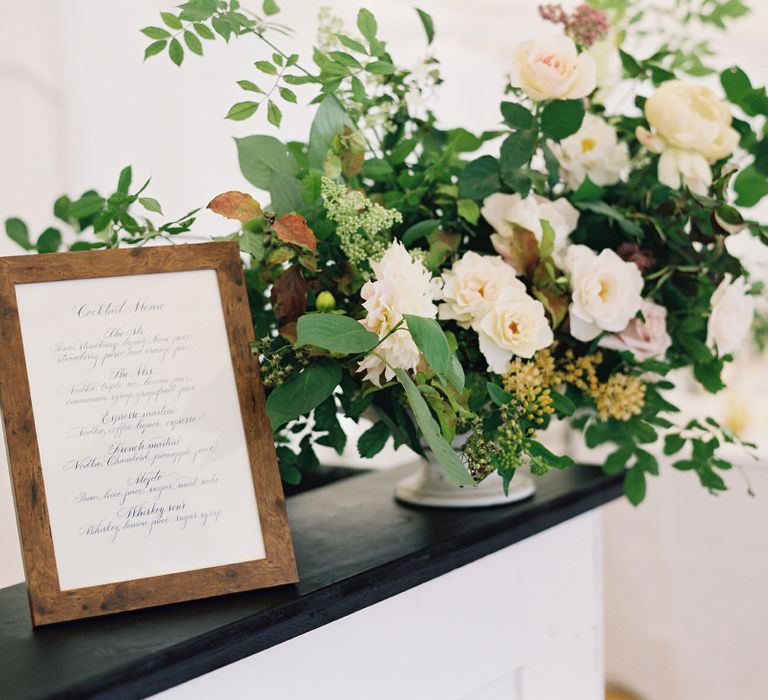 Floral Arrangement On Bar By Palais Flowers // Gold Cutlery With Pink Florals For Wedding // Image By Taylor And Porter