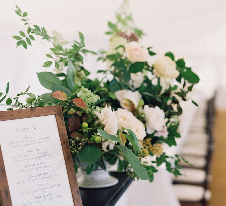 Floral Arrangement On Bar By Palais Flowers // Gold Cutlery With Pink Florals For Wedding // Image By Taylor And Porter