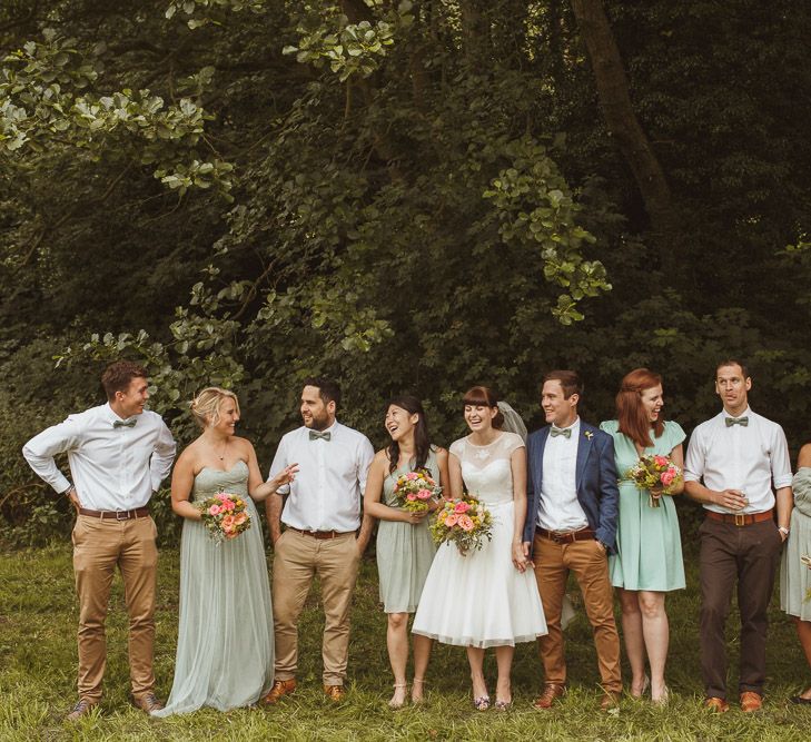 Wedding Party In Green With Brightly Coloured Bouquets