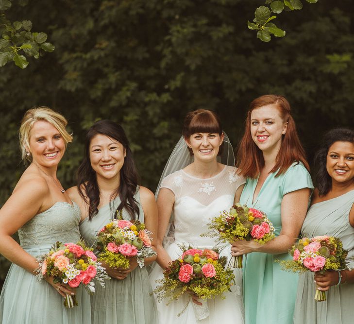 Wedding Party In Green With Brightly Coloured Bouquets