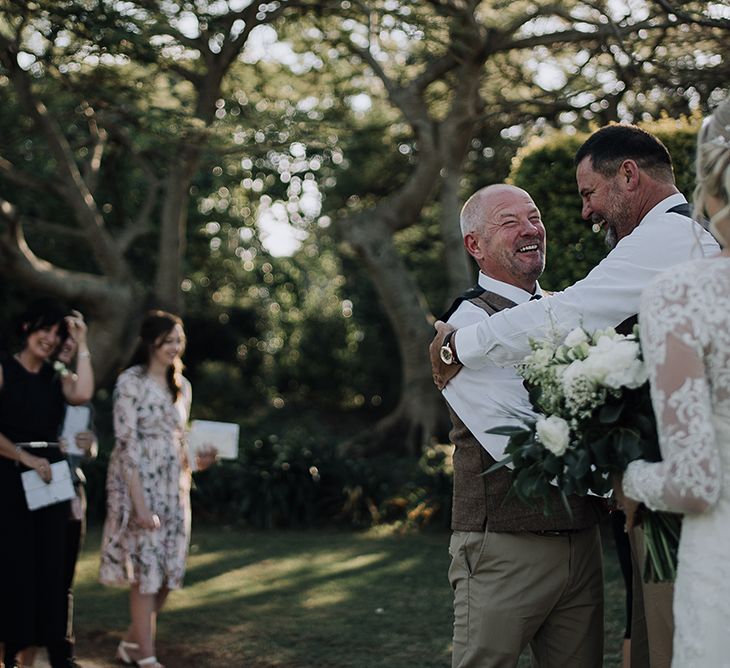 Bride in Lace Dress | Groom in Tweed Waistcoat & Chino's | Sophisticated White & Green Colour Scheme for an Outdoor Australian Wedding at Summer Grove | Photography & Film by Mad Rose Films