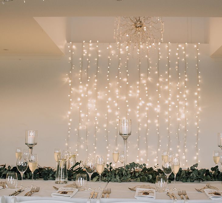 Fairy Light Curtain Top Table Backdrop | Sophisticated White & Green Colour Scheme for an Outdoor Australian Wedding at Summer Grove | Photography & Film by Mad Rose Films