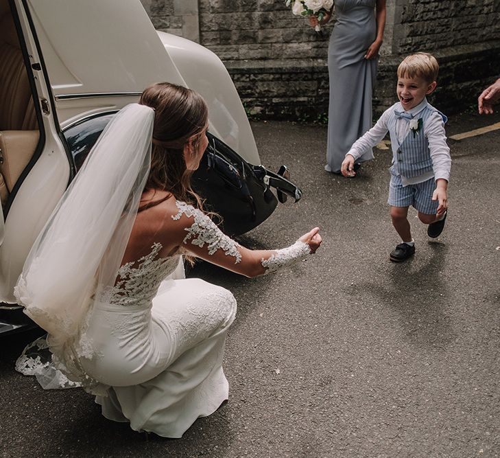 Church Wedding Ceremony | Bride in Lace Pronovias Bridal Gown | Page Boy | White and Silver English Country Garden At Home Marquee Wedding | Jason Mark Harris Photography