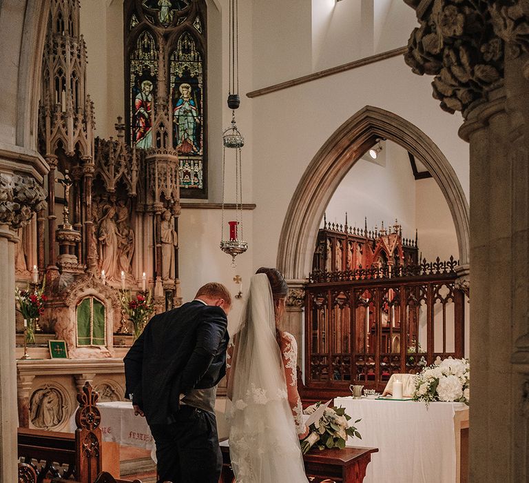 Church Wedding Ceremony | Bride in Lace Pronovias Bridal Gown | Groom in Thom Sweeney Suit | White and Silver English Country Garden At Home Marquee Wedding | Jason Mark Harris Photography