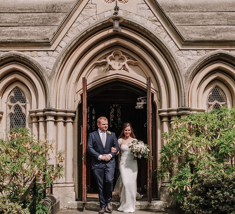 Bride in Lace Pronovias Bridal Gown | Groom in Thom Sweeney Suit | White and Silver English Country Garden At Home Marquee Wedding | Jason Mark Harris Photography